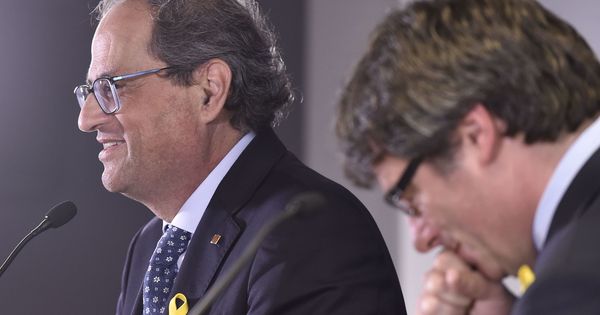 Foto: El presidente de la Generalitat, Quim Torra, y su predecesor Carles Puigdemont en una rueda de prensa en Bruselas. (Reuters)