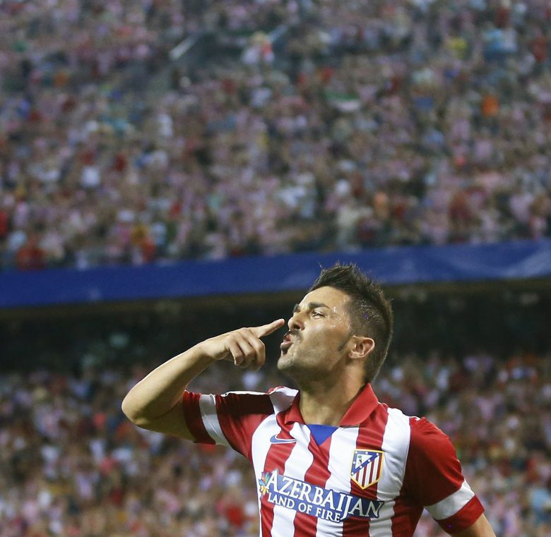 Atletico madrid's david villa celebrates his goal during their spanish supercup first leg soccer match against barcelona at the vicente calderon stadium in madrid