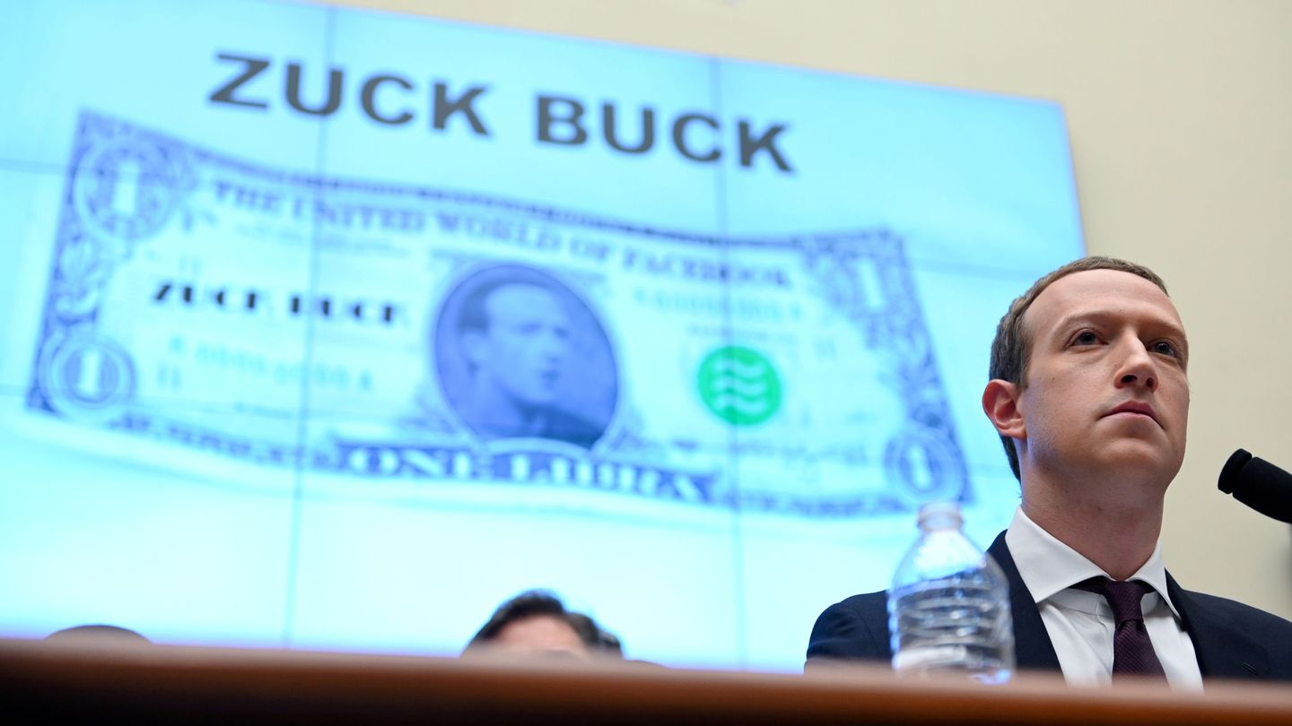FILE PHOTO: Facebook Chairman and CEO Mark Zuckerberg testifies in front of a projection of a 'Zuck Buck' at a House Financial Services Committee hearing examining the company's plan to launch a digital currency on Capitol Hill in Washington, U.S., October 23, 2019. REUTERS Erin Scott File Photo