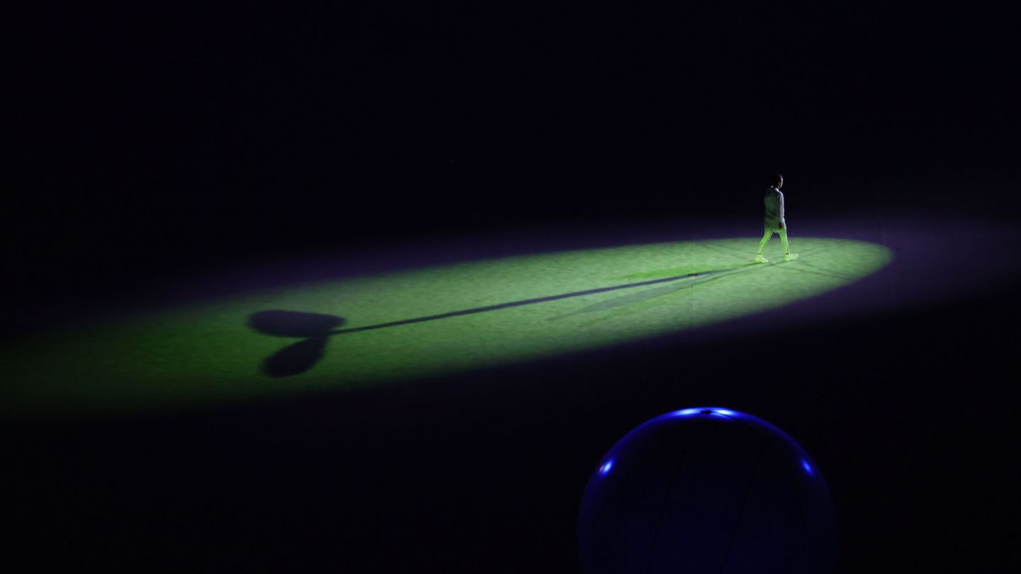 Tokyo 2020 Olympics - The Tokyo 2020 Olympics Opening Ceremony - Olympic Stadium, Tokyo, Japan - July 23, 2021. A person walks inside the stadium before the opening ceremony. REUTERS Leonhard Foeger