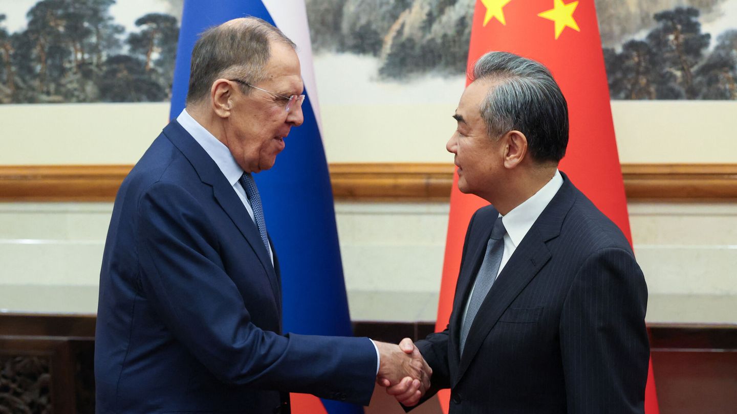Russian Foreign Minister Sergei Lavrov shakes hands with Chinese Foreign Minister Wang Yi during a meeting in Beijing, China October 16, 2023. Russian Foreign Ministry Handout via REUTERS ATTENTION EDITORS - THIS IMAGE WAS PROVIDED BY A THIRD PARTY. NO RESALES. NO ARCHIVES. MANDATORY CREDIT.