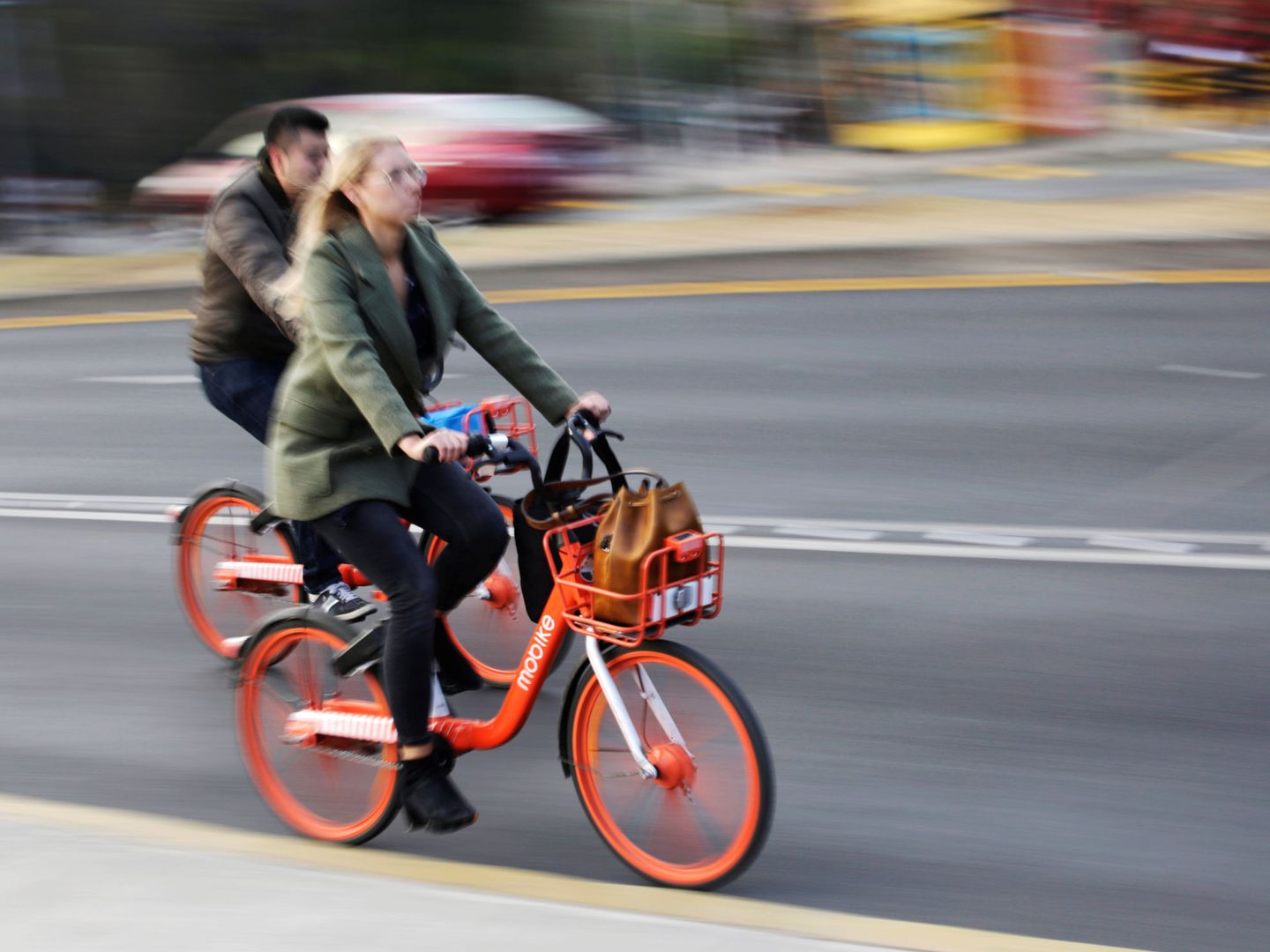 People ride bikes from Chinese bike-sharing company Mobike in Mexico City, Mexico January 10, 2019. REUTERS Daniel Becerril