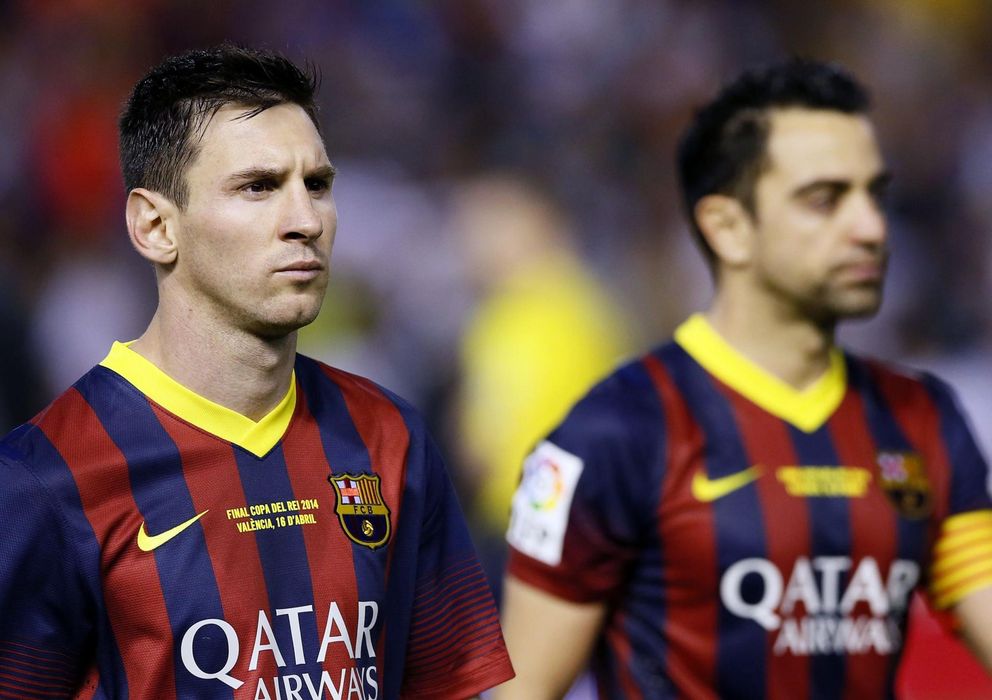 Foto: Xavi y Messi reflejan en sus rostros la derrota sufrida ante el Real Madrid (Reuters)