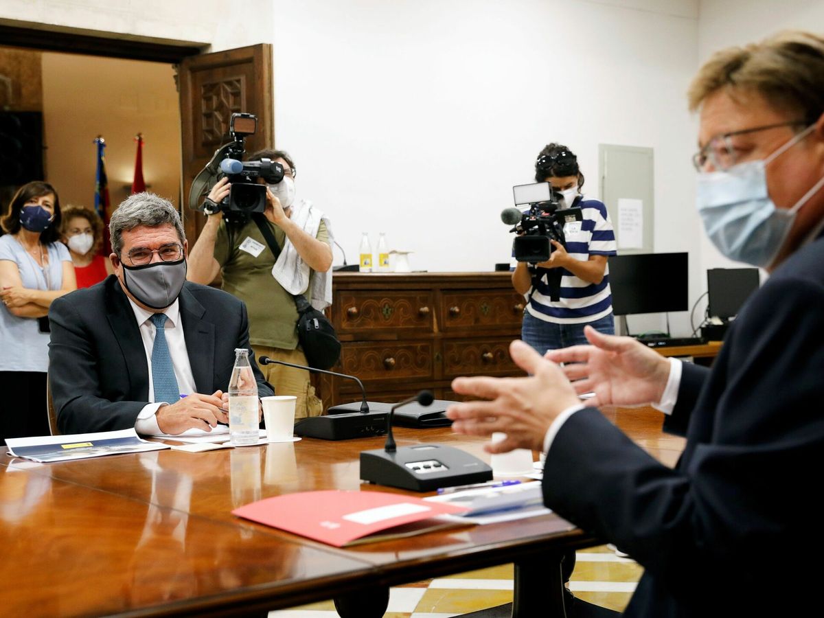 Foto: El 'president' de la Generalitat valenciana, Ximo Puig (d), y el ministro de Inclusión, Seguridad Social y Migraciones, José Luis Escrivá. (EFE)