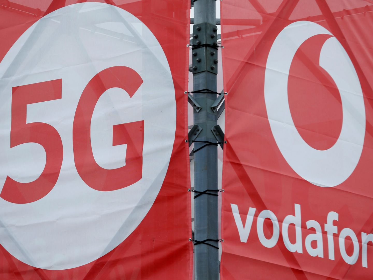 FILE PHOTO: Logos of 5G technology and telecommunications company Vodafone are pictured at the 5G Mobility Lab of Vodafone in Aldenhoven, Germany, November 27, 2018.REUTERS Thilo Schmuelgen File Photo