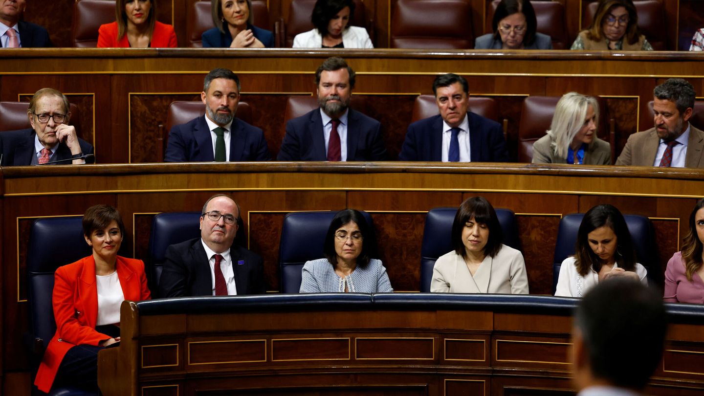 Economist Ramon Tamames, leader of the Spanish far-right party Vox Santiago Abascal and other lawmakers listen to Spanish Prime Minister Pedro Sanchez speak during a no confidence motion against the government at the parliament in Madrid, Spain, March 21, 2023. REUTERS Susana Vera