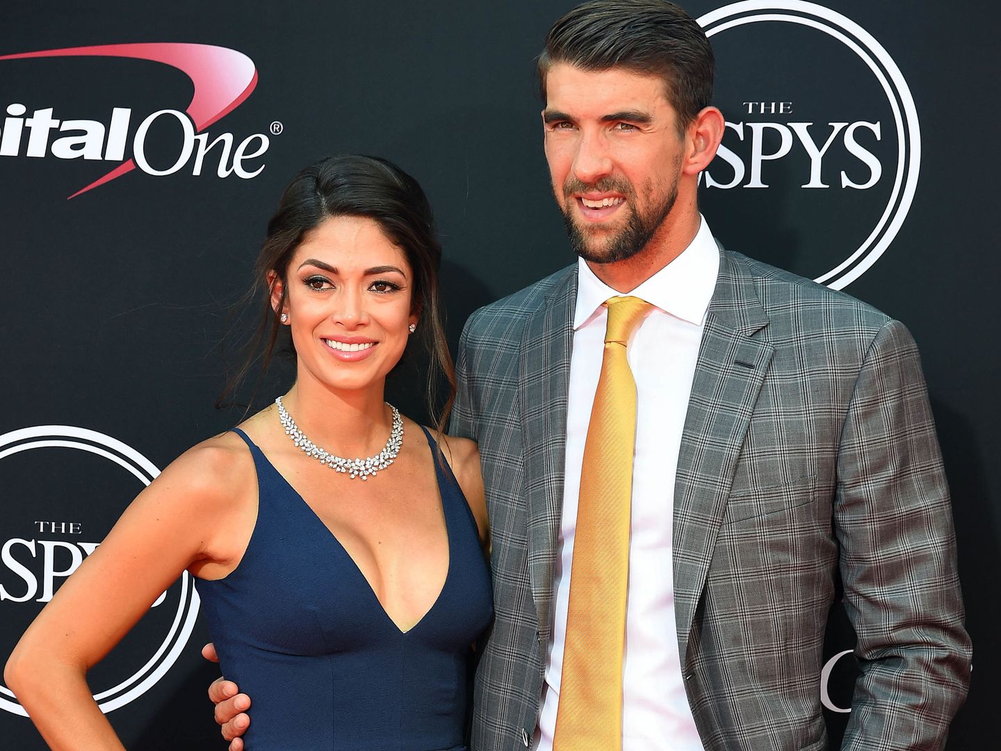 Michael Phelps y su mujer Nicole Johnson. (USA TODAY Sports)