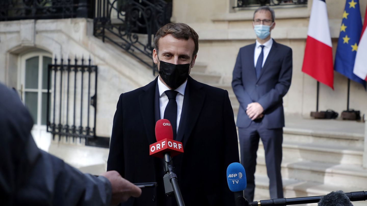 French President Emmanuel Macron speaks to the media after signing a condolence book for victims of the Vienna shooting as Deputy Head of Mission at the Austrian Embassy Wolfgang Wagner looks on, in Paris, France, November 3, 2020. Christophe Petit Tesson Pool via REUTERS