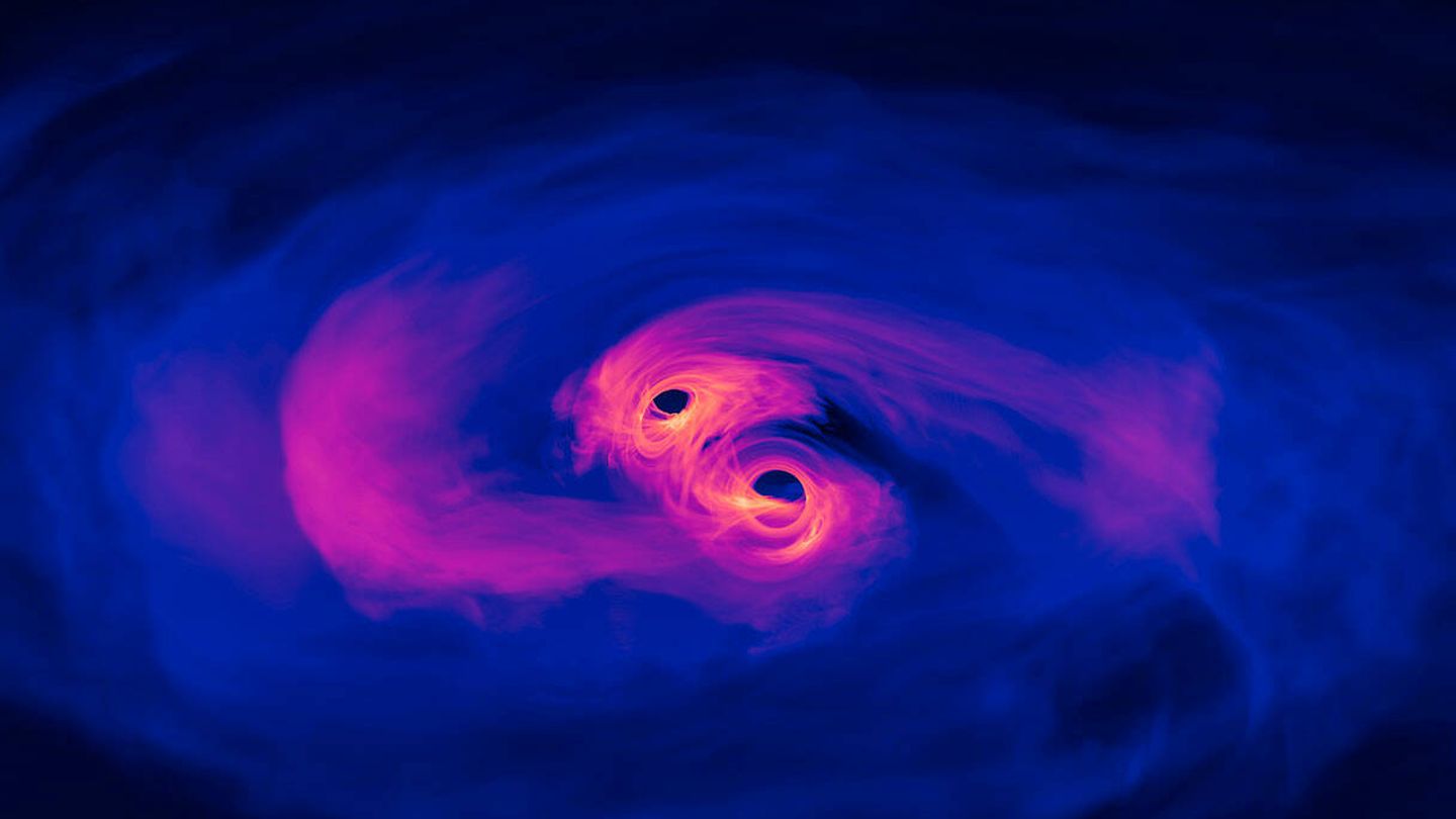 Simulación de dos agujeros negros a punto de converger. (NASA)