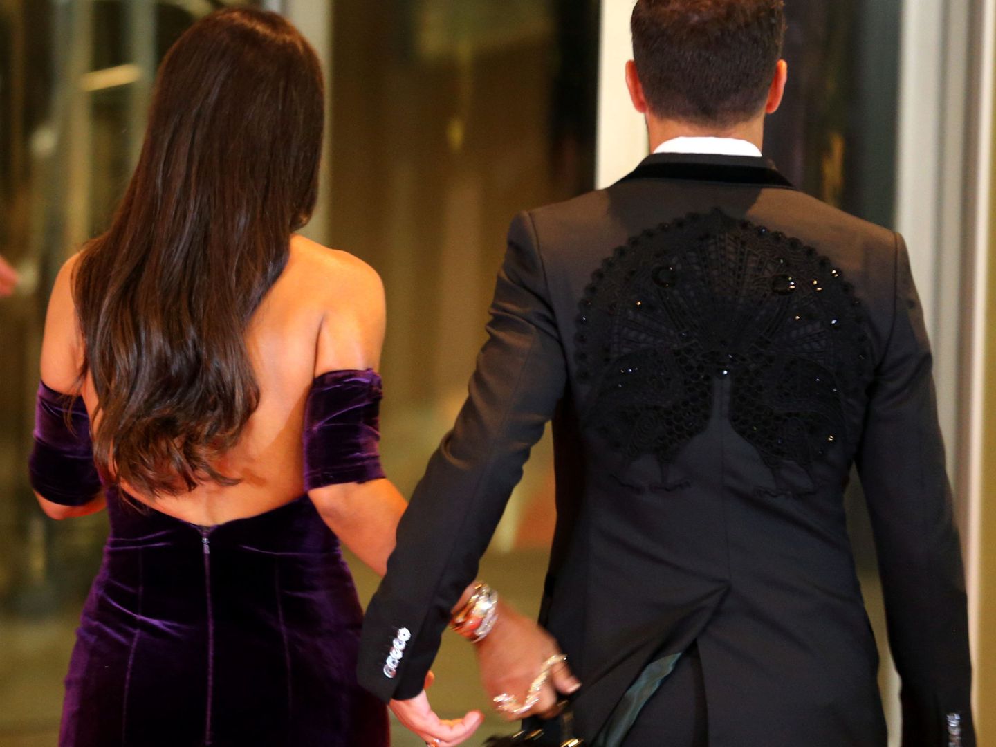 Argentine soccer player Lionel Messi's former Barcelona FC teammate Cesc Fabregas and his wife Daniella Semaan leave after posing for photographers as they arrive to the wedding of Messi and Antonela Roccuzzo in Rosario, Argentina, June 30, 2017. REUTERS Marcos Brindicci
