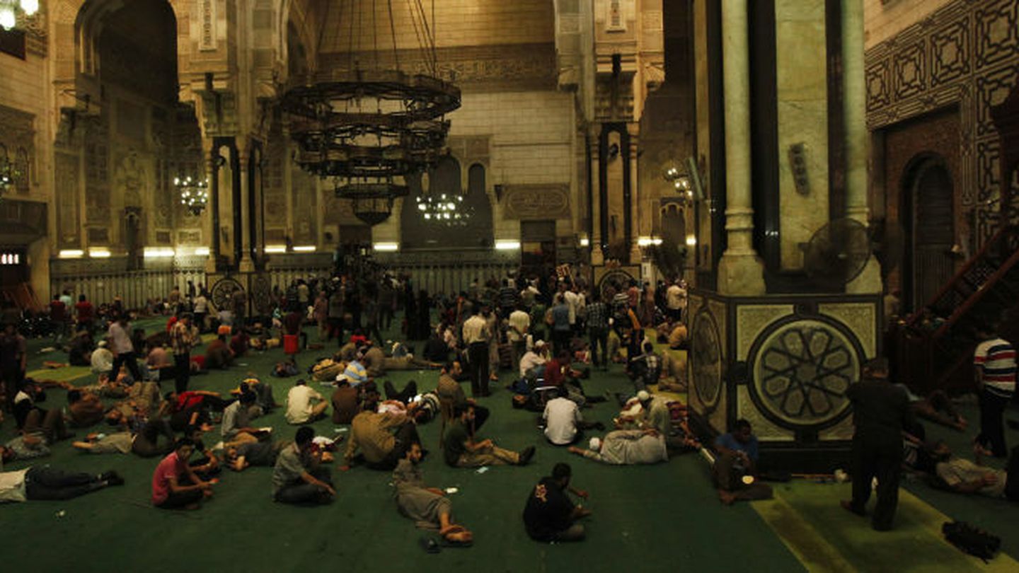 Demonstrators who support ousted Egyptian President Mohamed Mursi sit inside al-Fath mosque at Ramses Square in Cairo