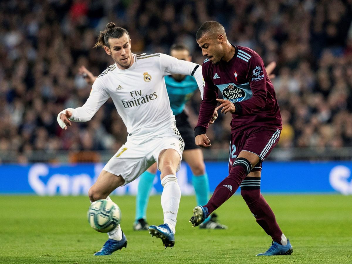 Foto: Gareth Bale pelea por un balón con Rafinha en el partido contra el Celta en el Bermabéu. (Efe)
