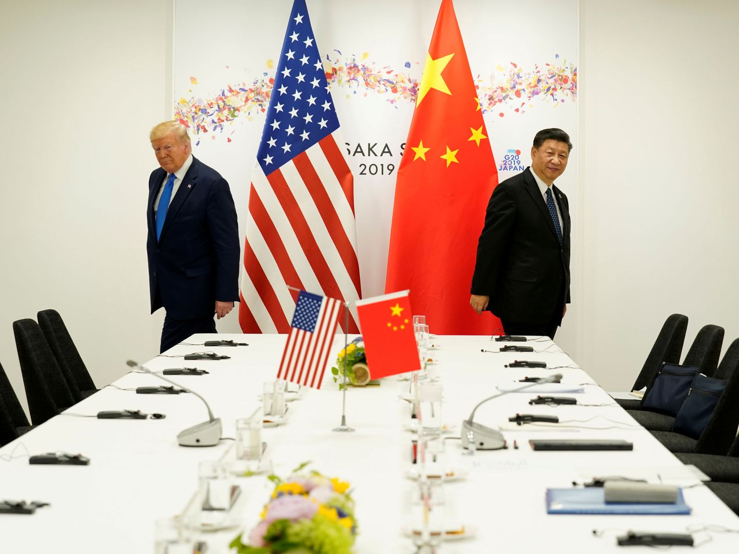 Donald Trump (i) y Xi Jinping, durante un encuentro. (Reuters)
