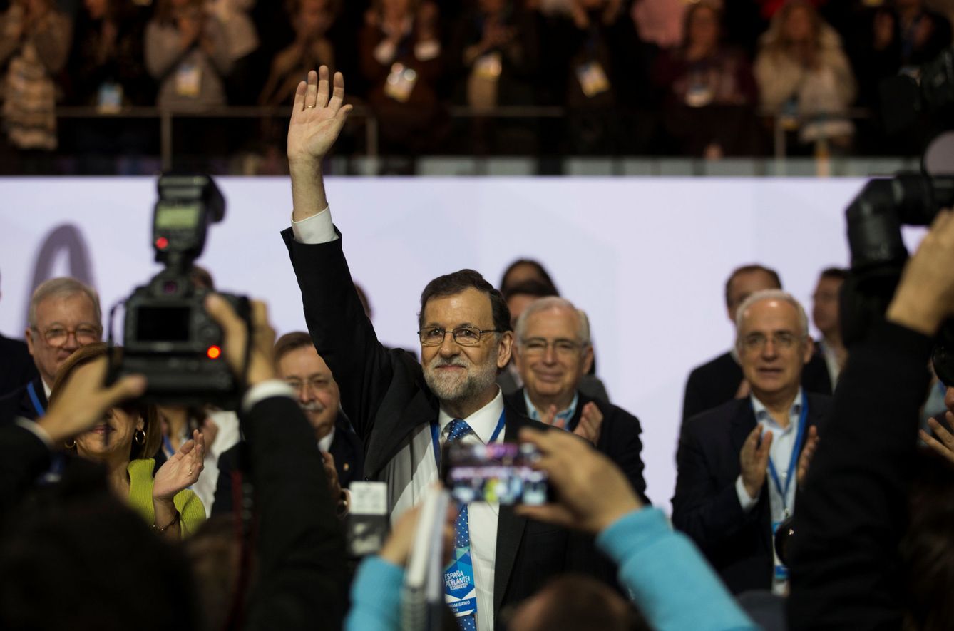 Spanish Prime Minister Mariano Rajoy waves from the stage during his ruling People's Party (PP) national convention in Madrid, Spain, February 12, 2017. REUTERS Sergio Perez