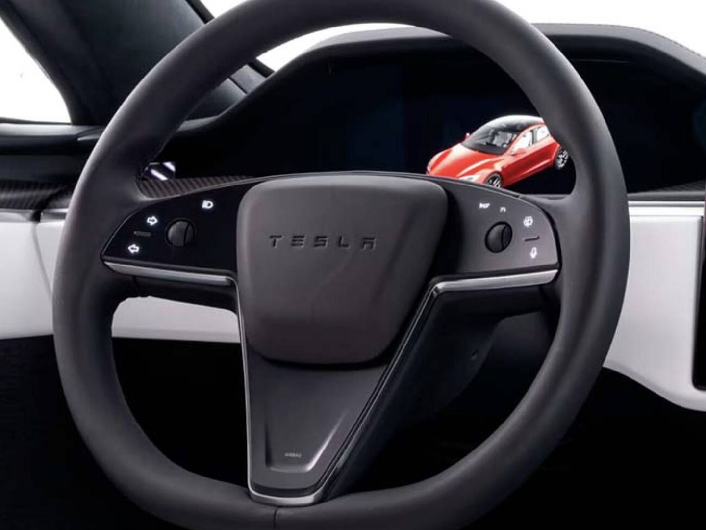 Un volante de Tesla con los botones táctiles para los intermitentes (Tesla)
