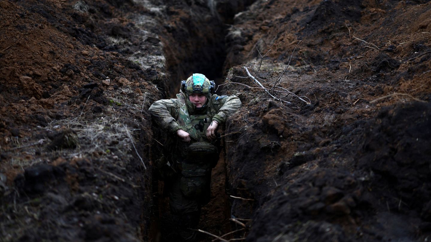 A Ukrainian serviceman hides in a trench near the frontline town of Bakhmut amid Russia's attack on Ukraine, Donetsk region, Ukraine March 8, 2023. REUTERS Lisi Niesner