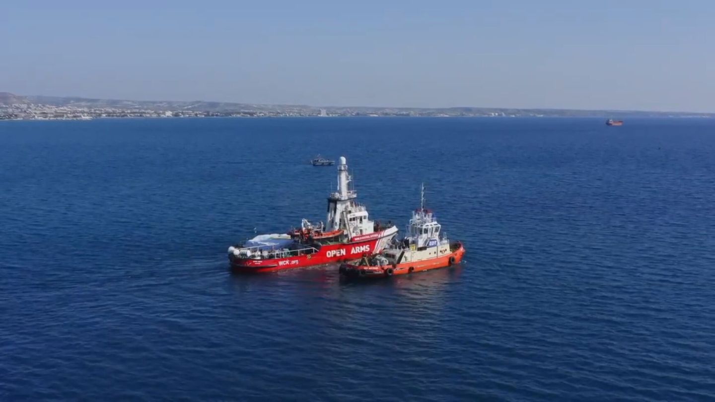Larnaca (Cyprus), 12 03 2024.- A still taken from a handout drone video made available by World Central Kitchen (WCK) shows the Open Arms NGO rescue vessel (C) being towed at open sea dragging a barge (L) loaded with food aid provided by WCK, as it leaves port headed for the Gaza Strip, in Larnaca, Cyprus, 12 March 2024. According to a statement by Open Arms, the NGO and World Central Kitchen (WCK) have overseen the departure of their first Gaza bound food aid boat on 12 March from Larnaca, Cyprus. The aid consists of about 200 tons of food (flour, rice and canned food), it will aim to 