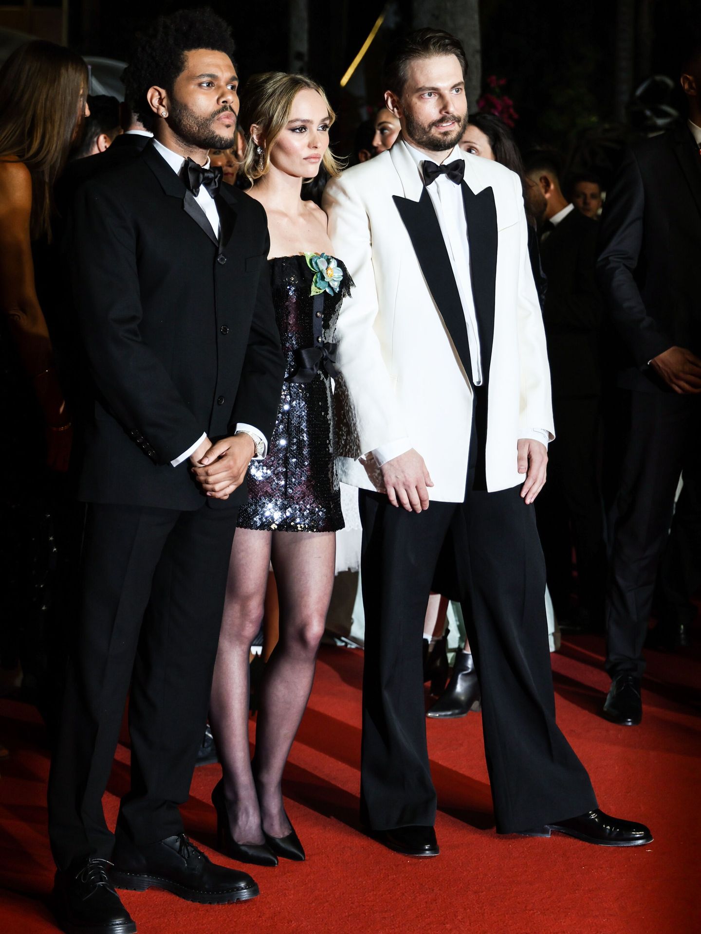 Abel Makkonen Tesfaye, Lily-Rose Depp y Sam Levinson. (EFE/Mohammed Badra)