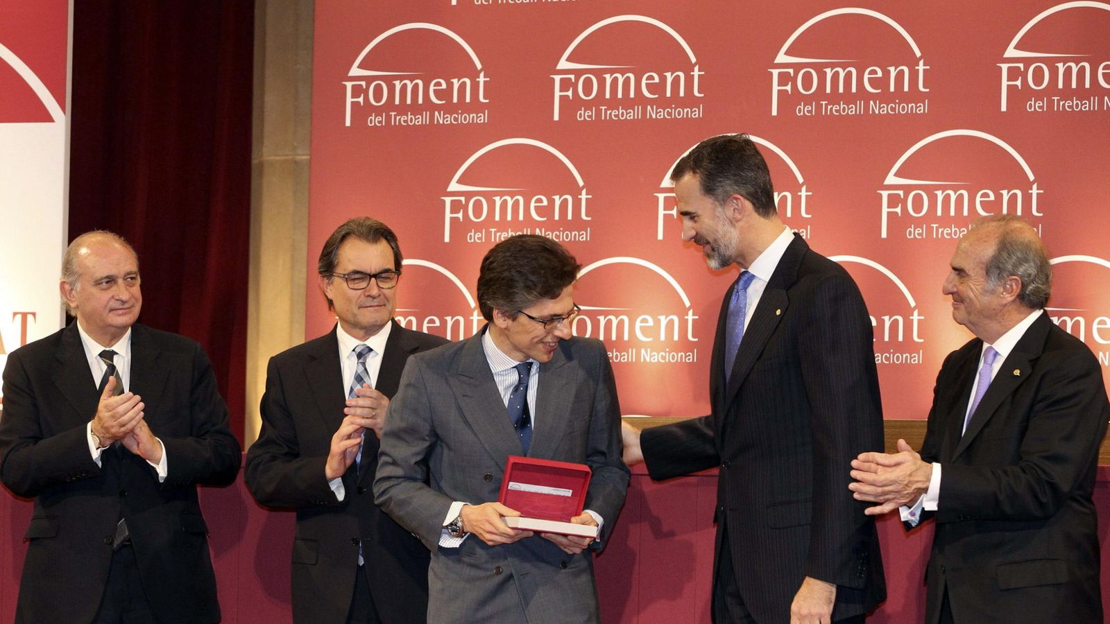 Foto: Umberto Bonomi, de Investindustrial (c), recibe la Medalla de Honor como Empresario del Año en 2014. (EFE)