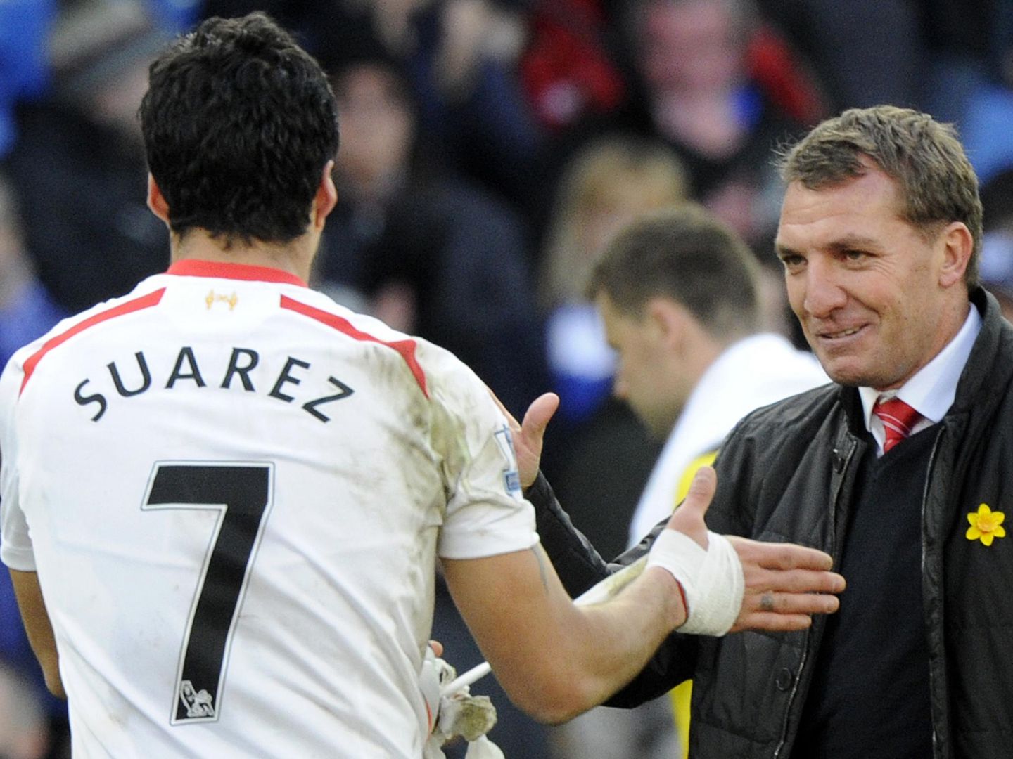 Liverpool's manager rodgers congratulates suarez after scoring a hat trick against cardiff city during their english premier league soccer match at cardiff city stadium
