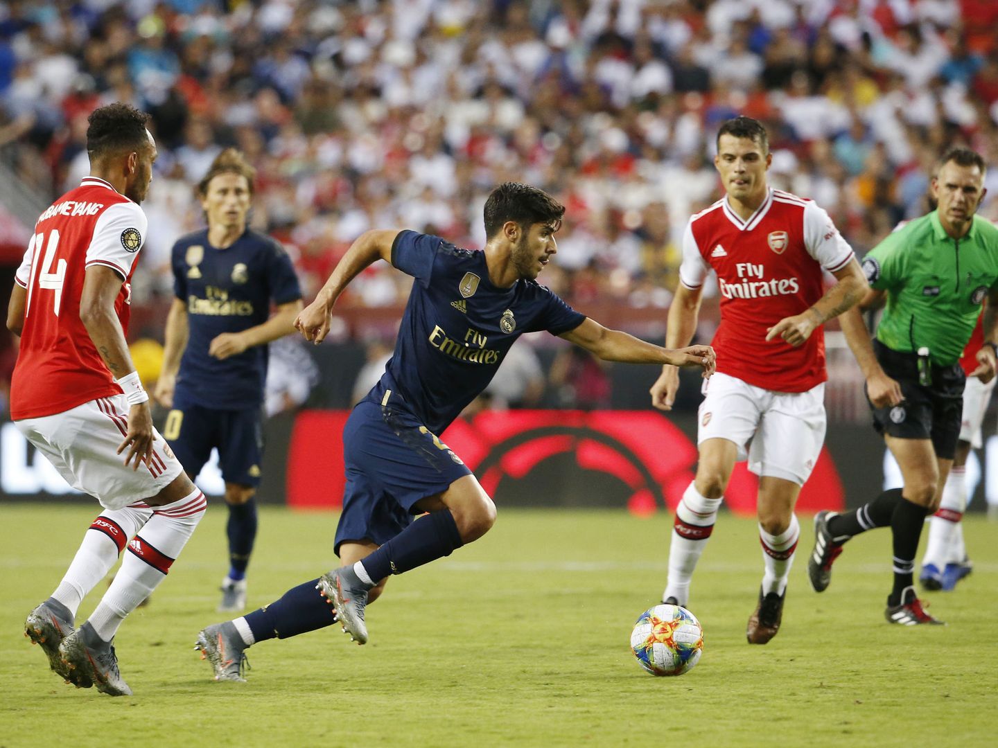 Marco Asensio durante el partido contra el Arsenal. (Efe)