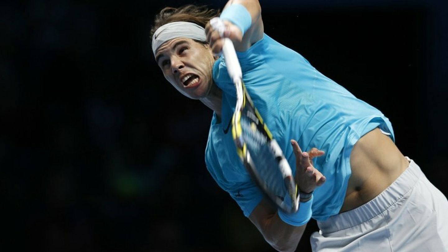 Nadal of spain serves during his men's singles tennis match against compatriot ferrer at the atp world tour finals at the o2 arena in london