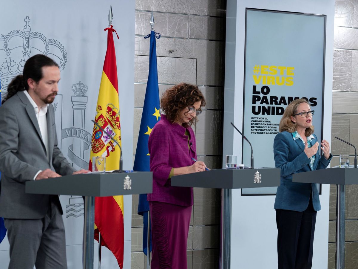 Foto: Pablo Iglesias, María Jesús Montero y Nadia Calviño, explicando esta medida. (EFE)