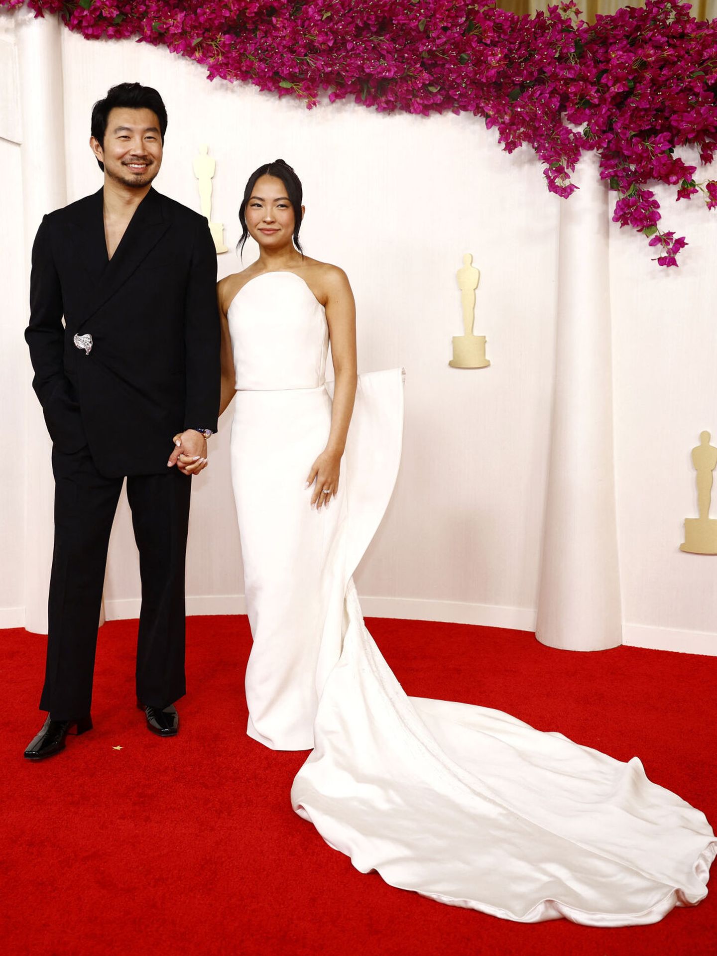 Simu Liu and Allison Hsu pose on the red carpet during the Oscars arrivals at the 96th Academy Awards in Hollywood, Los Angeles, California, U.S., March 10, 2024. REUTERS Sarah Meyssonnier