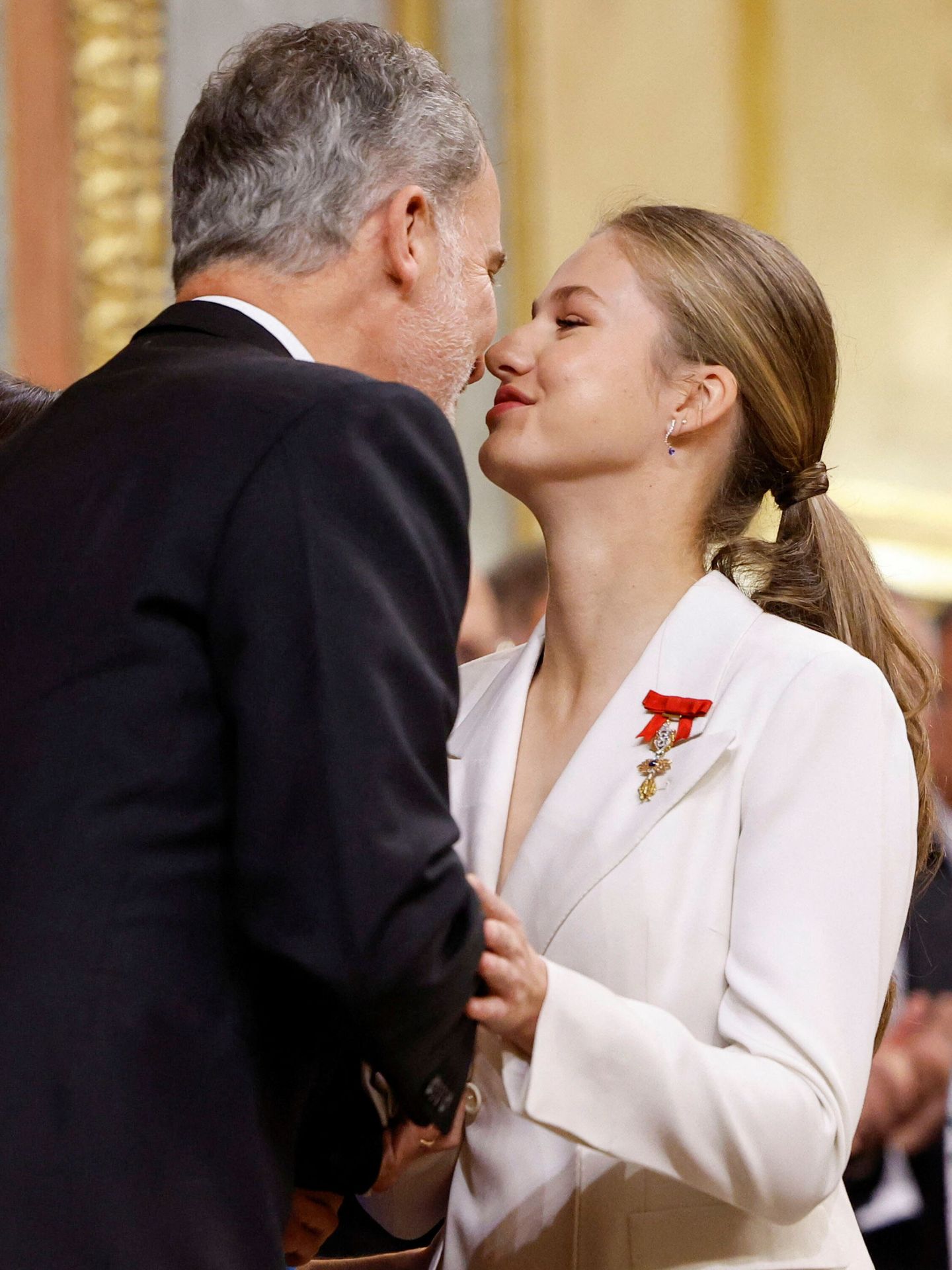 Spain's Princess Leonor kisses her father, King Felipe, after swearing an oath to the constitution at the parliament in Madrid, Spain, October 31, 2023. REUTERS Juan Medina