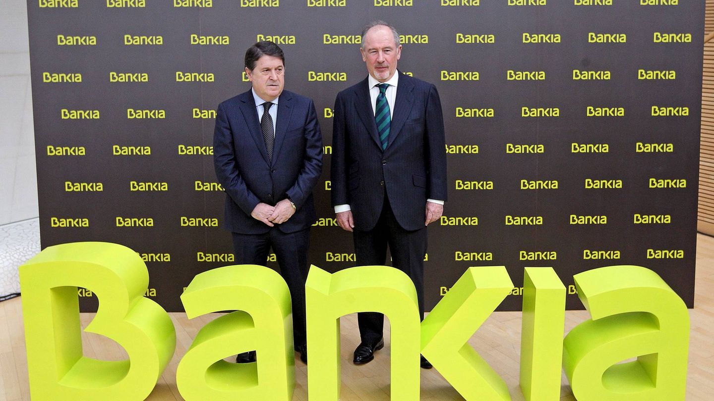 Rodrigo Rato (d) y José Luis Olivas (i), en la salida a bolsa de Bankia en 2011. (EFE)