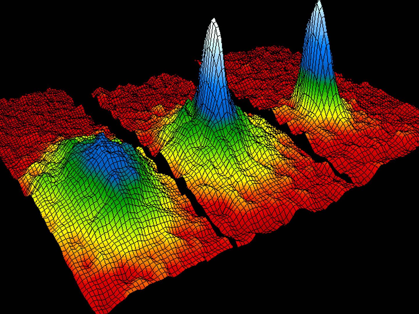 Representación del condensado de Bose-Einstein, estado de agregación de la materia que se da en ciertos materiales a temperaturas cercanas al cero absoluto. La coloración indica la cantidad de átomos moviéndose a cada velocidad, donde el blanco y el azul son las velocidades más bajas