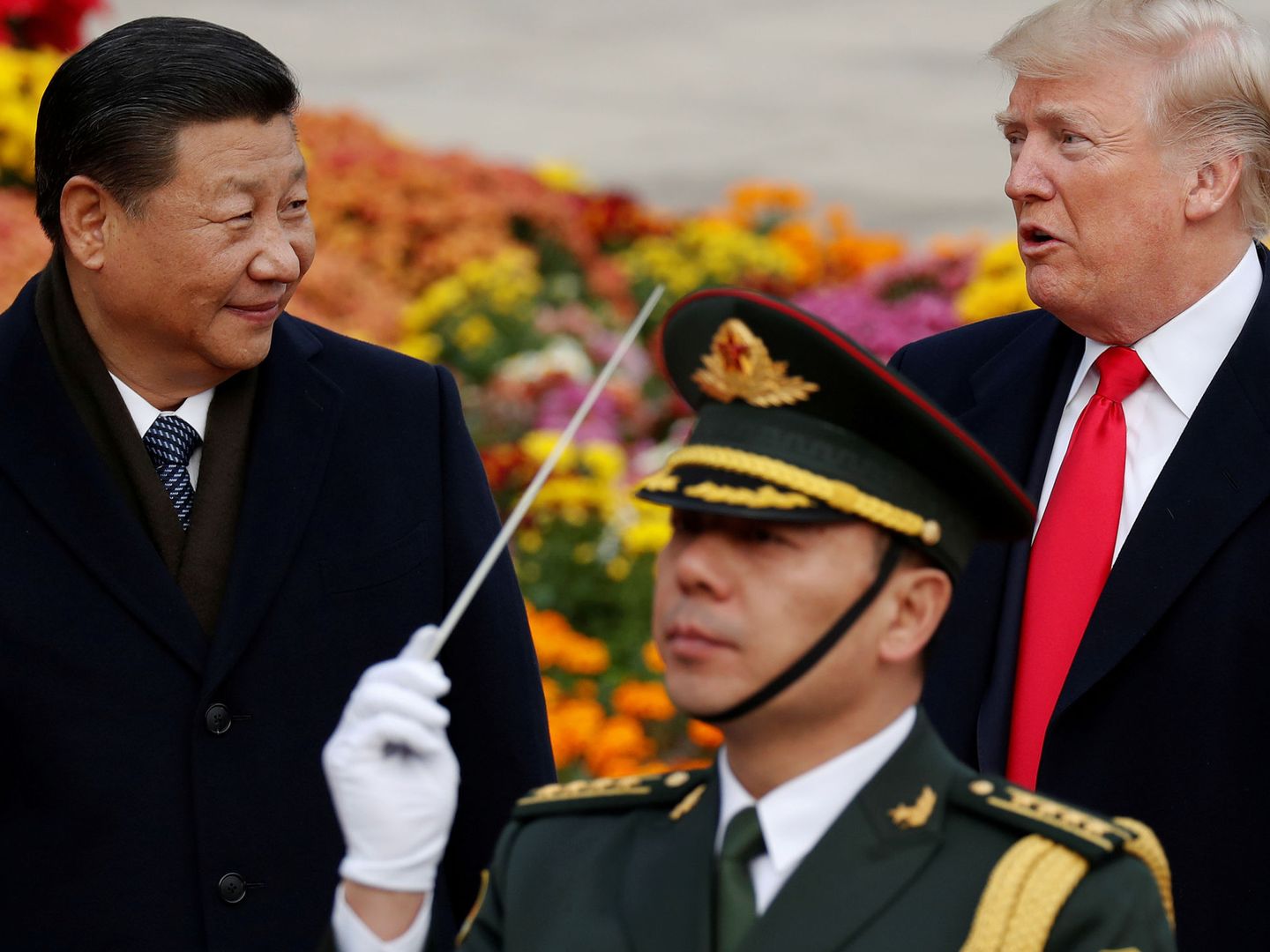 FILE PHOTO: U.S. President Donald Trump takes part in a welcoming ceremony with China's President Xi Jinping at the Great Hall of the People in Beijing, China, November 9, 2017. REUTERS Damir Sagolj File Photo