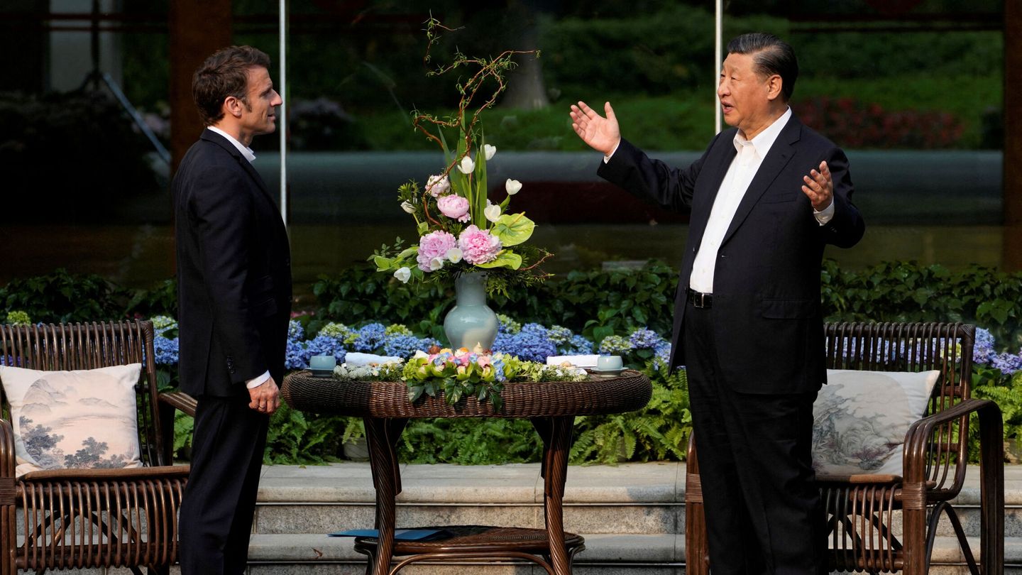 Chinese President Xi Jinping and France’s President Emmanuel Macron talk prior to a tea ceremony at the Guandong province governor’s residence, in Guangzhou, China, Friday, April 7, 2023. Thibault Camus Pool via REUTERS