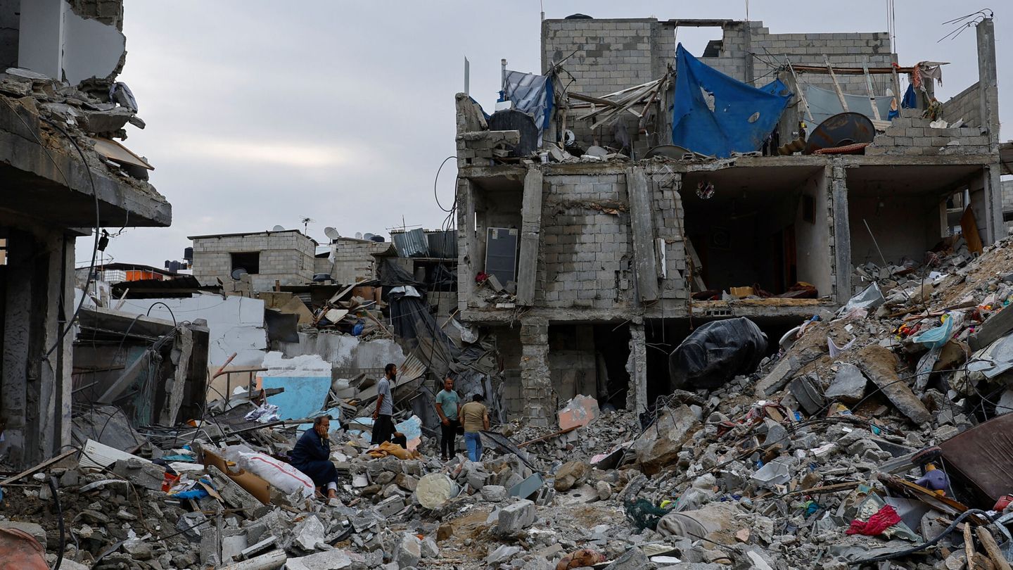 Palestinians inspect buildings destroyed in Israeli strikes, in Rafah in the southern Gaza Strip October 9, 2023. REUTERS Ibraheem Abu Mustafa