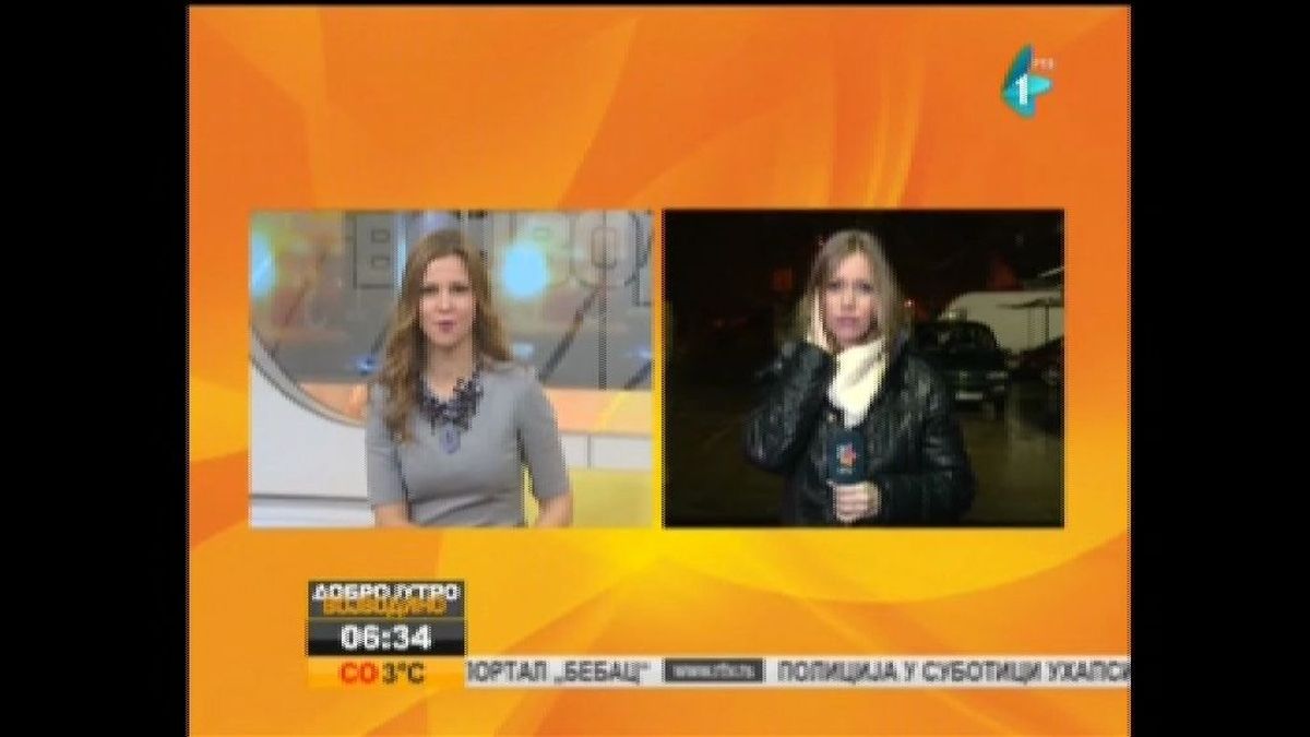 Un desconocido muestra una pistola a una reportera de TV serbia en pleno directo