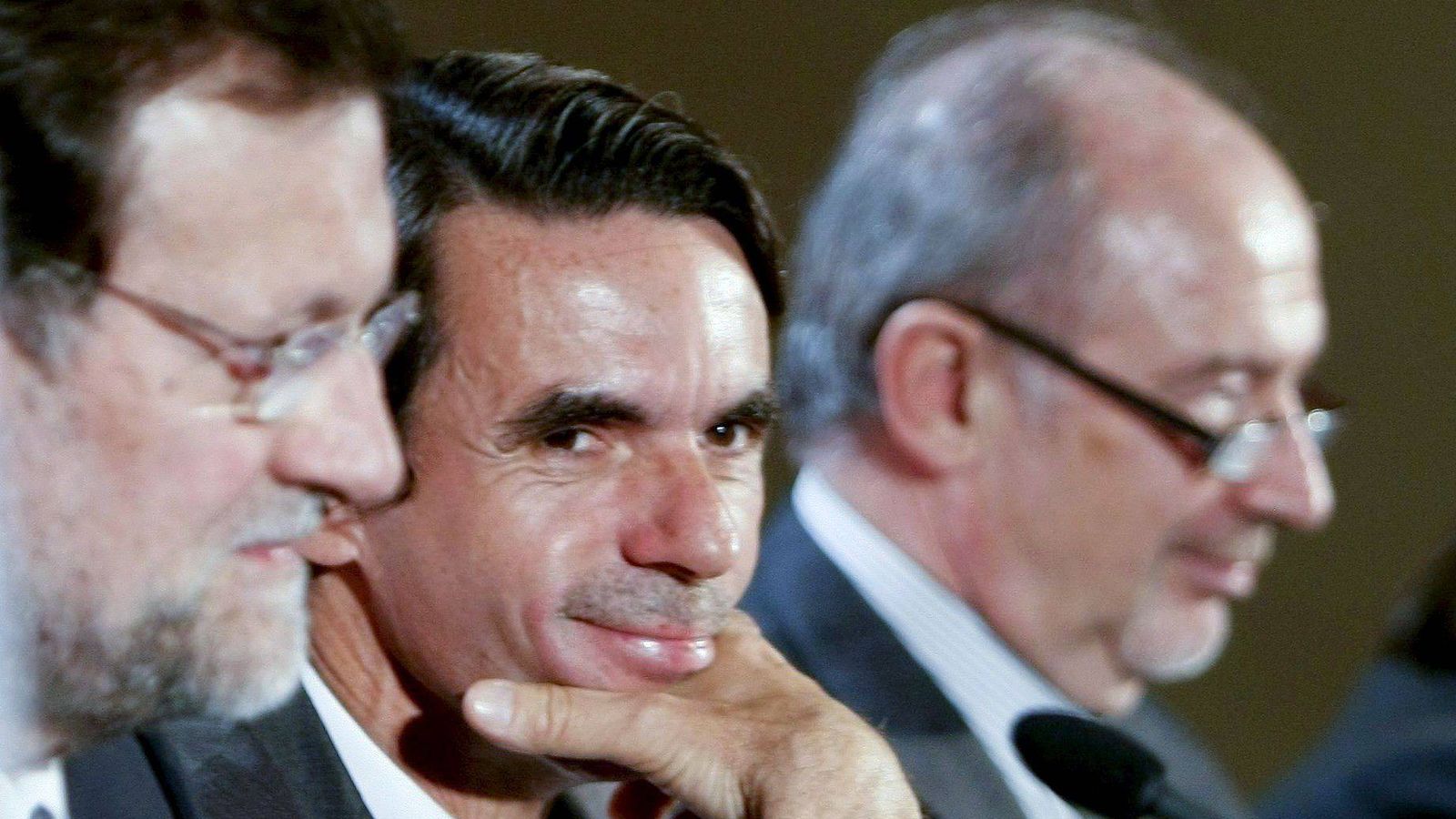 Foto: De izquierda a derecha: Mariano Rajoy, José María Aznar y Rodrigo Rato. (EFE)