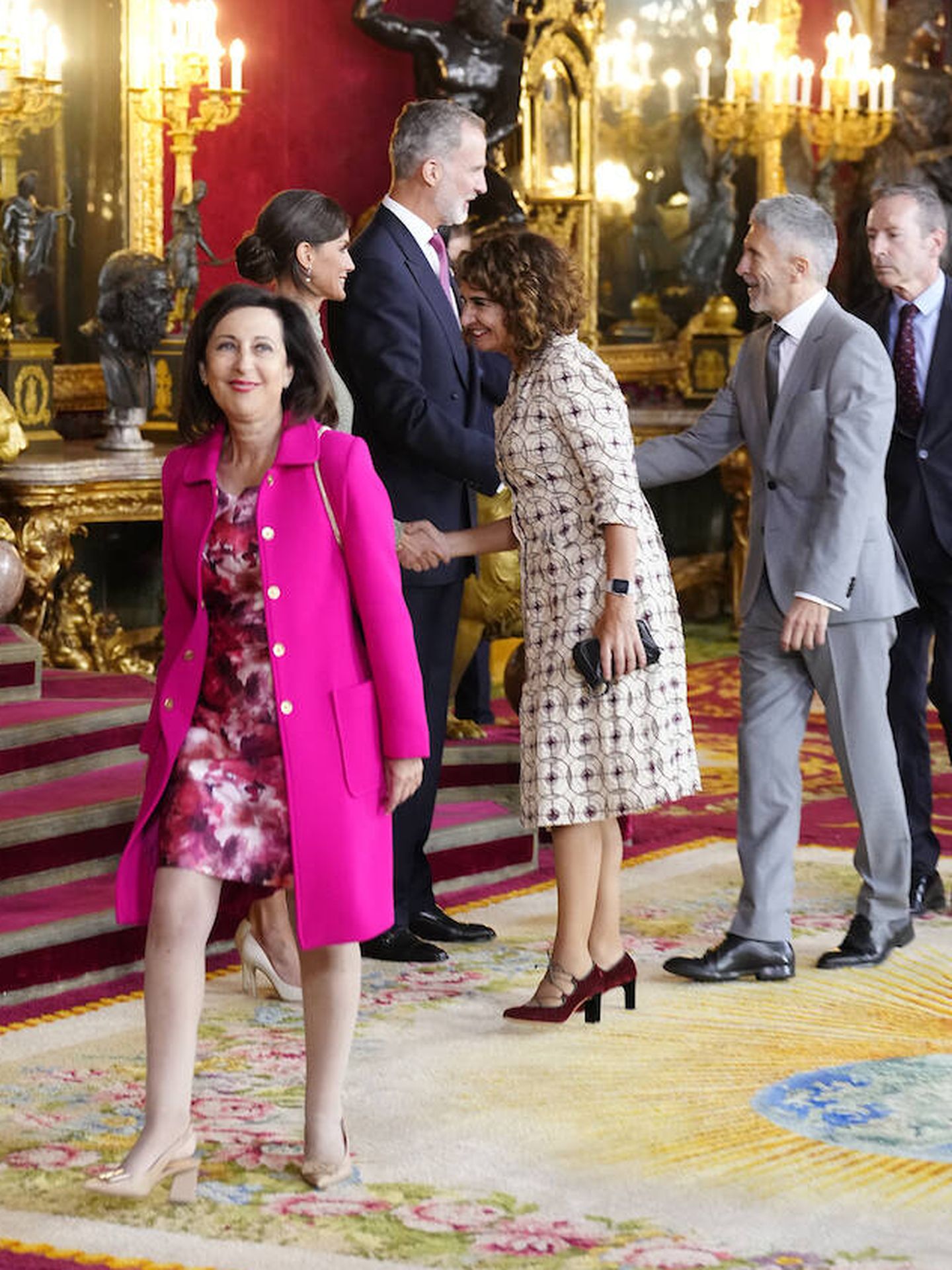 Margarita Robles, María Jesús Montero y Grande-Marlaska, en la recepción en el Palacio Real. (LP)