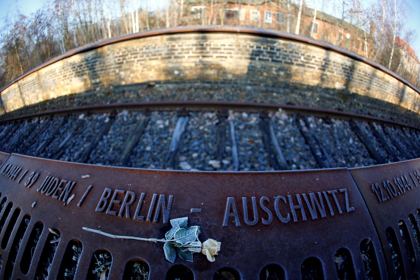 A frozen rose is seen next to the word 'Auschwitz' at the Gleis 17 (Platform 17) memorial, a platform at Berlin-Grunewald train station from where some 50,000 Jewish citizens were deported by train to the Nazi concentration camps between 1941 and 1945, in Berlin, Germany, January 24, 2020.    Picture taken with a fish-eye lens.  REUTERS Fabrizio Bensch     TPX IMAGES OF THE DAY