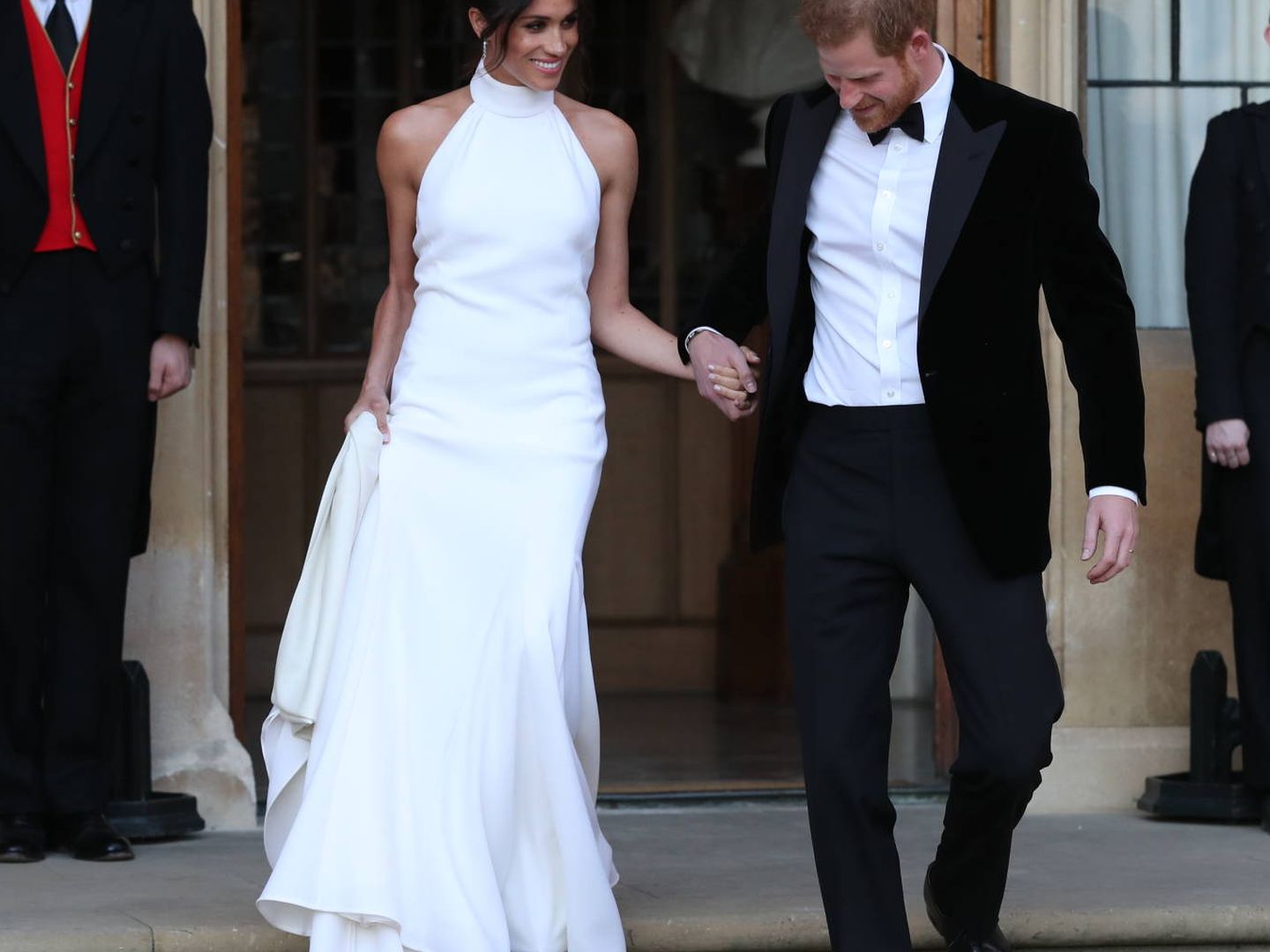 WINDSOR, UNITED KINGDOM - MAY 19: Duchess of Sussex and Prince Harry, Duke of Sussex leave Windsor Castle after their wedding to attend an evening reception at Frogmore House, hosted by the Prince of Wales on May 19, 2018 in Windsor, England. (Photo by Steve Parsons - WPA Pool/Getty Images)