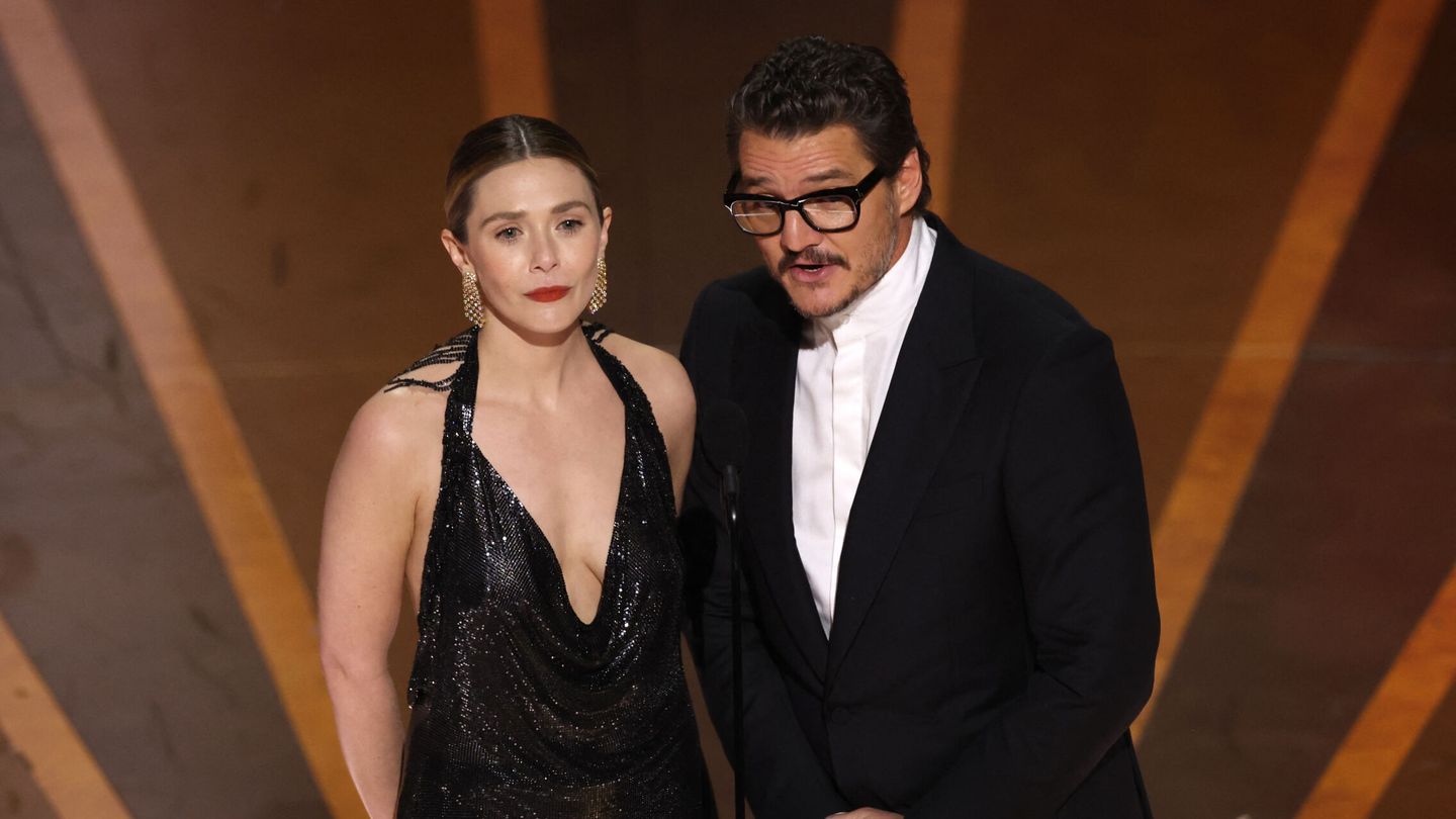 Pedro Pascal and Elizabeth Olsen take the stage to present an award during the Oscars show at the 95th Academy Awards in Hollywood, Los Angeles, California, U.S., March 12, 2023. REUTERS Carlos Barria