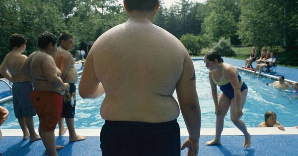 Foto: Gente obesa en la piscina. (Corbis)