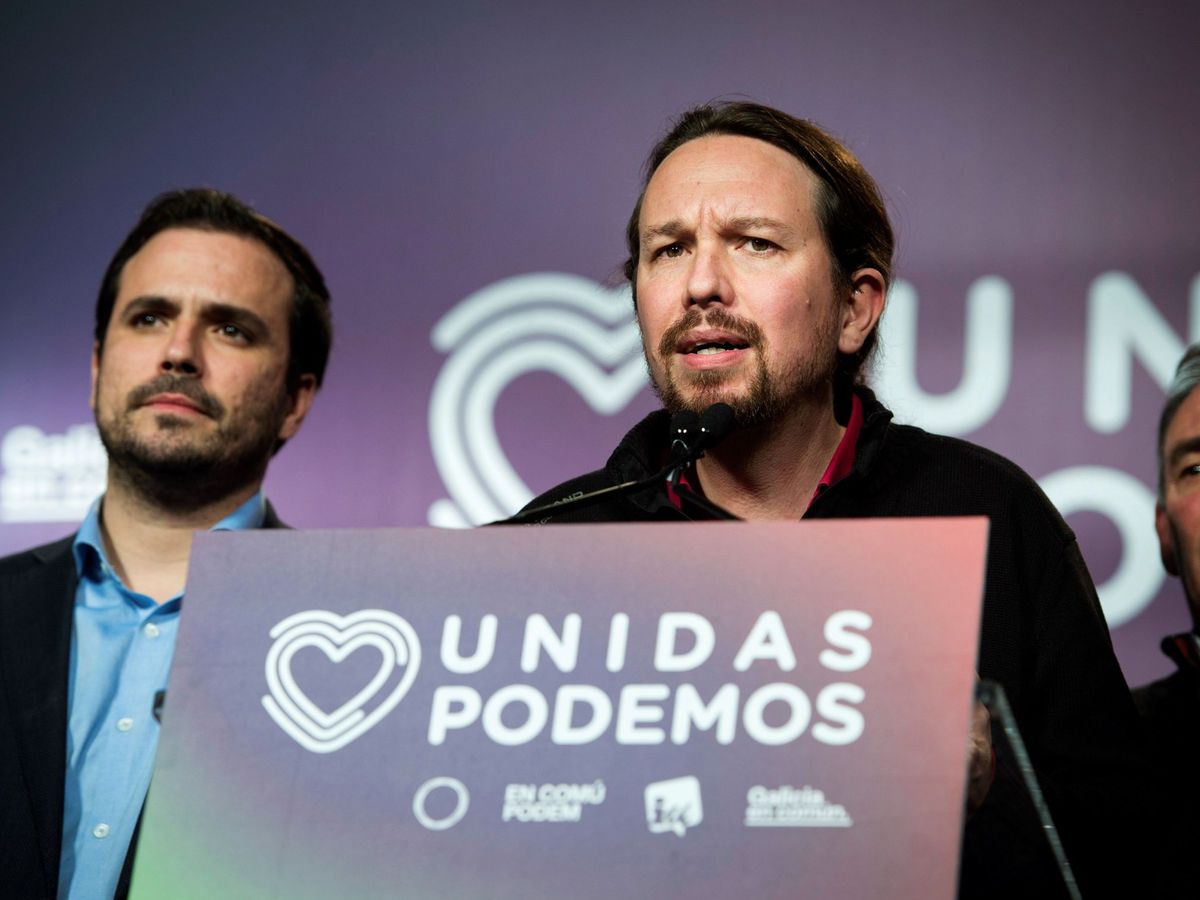 Foto: El secretario general de Unidas Podemos, Pablo Iglesias, comparece junto al líder de IU, Alberto Garzón, durante la noche electoral. (EFE)