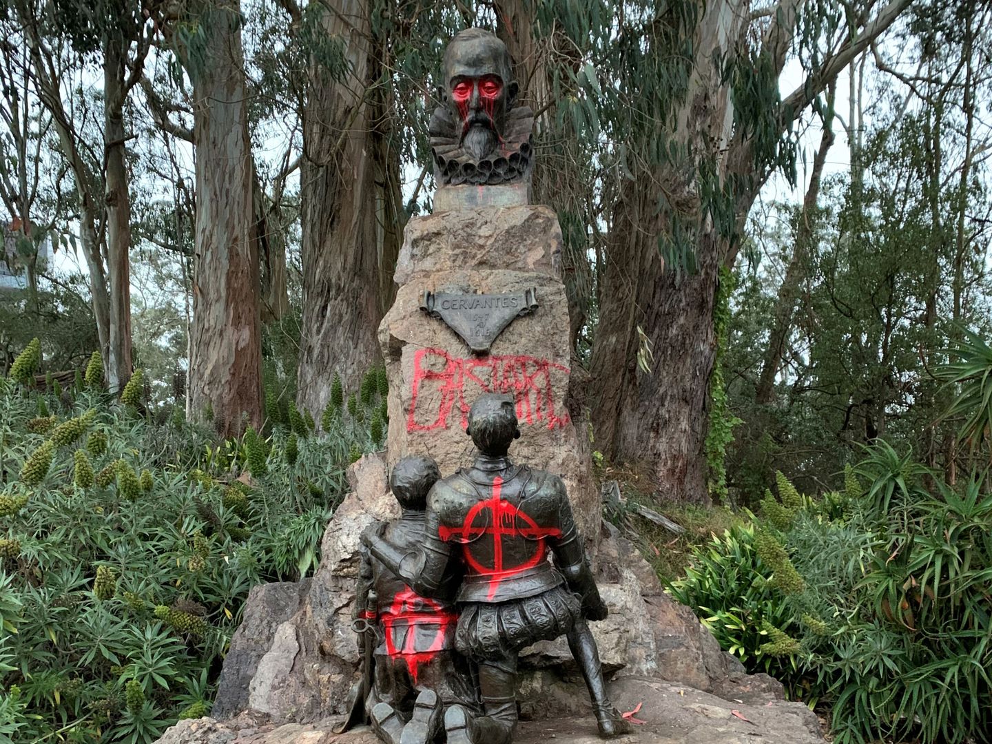 Miguel De Cervantes memorial is vandalised with red spray paint, in San Francisco, California, U.S. June 19, 2020, in this picture obtained from social media. Picture taken June 19, 2020. David Zandman via REUTERS THIS IMAGE HAS BEEN SUPPLIED BY A THIRD PARTY. MANDATORY CREDIT. NO RESALES. NO ARCHIVES.
