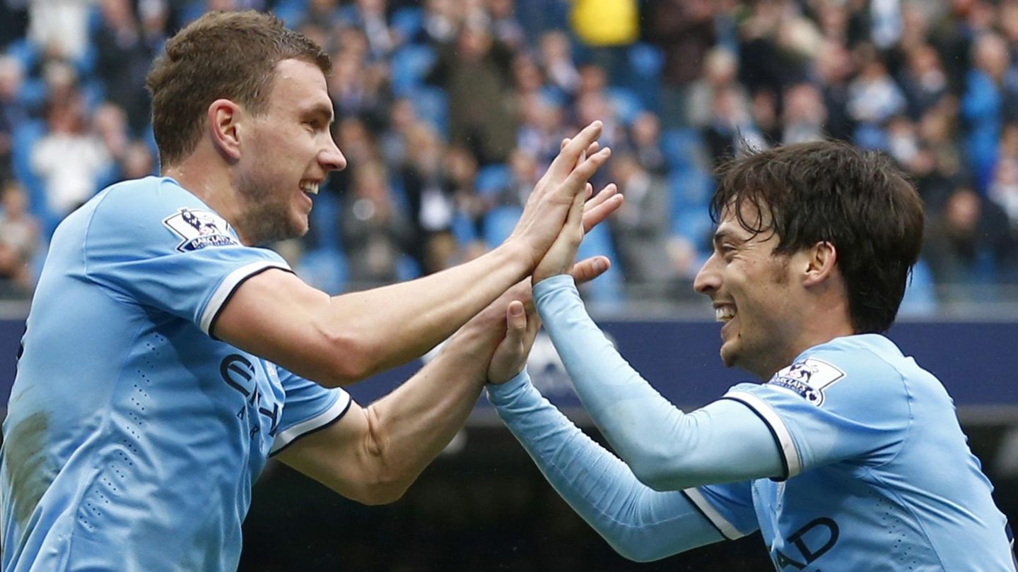 Manchester city's dzeko celebrates with team mate david silva after scoring a goal during their english premier league soccer match against southampton at the etihad stadium in manchester