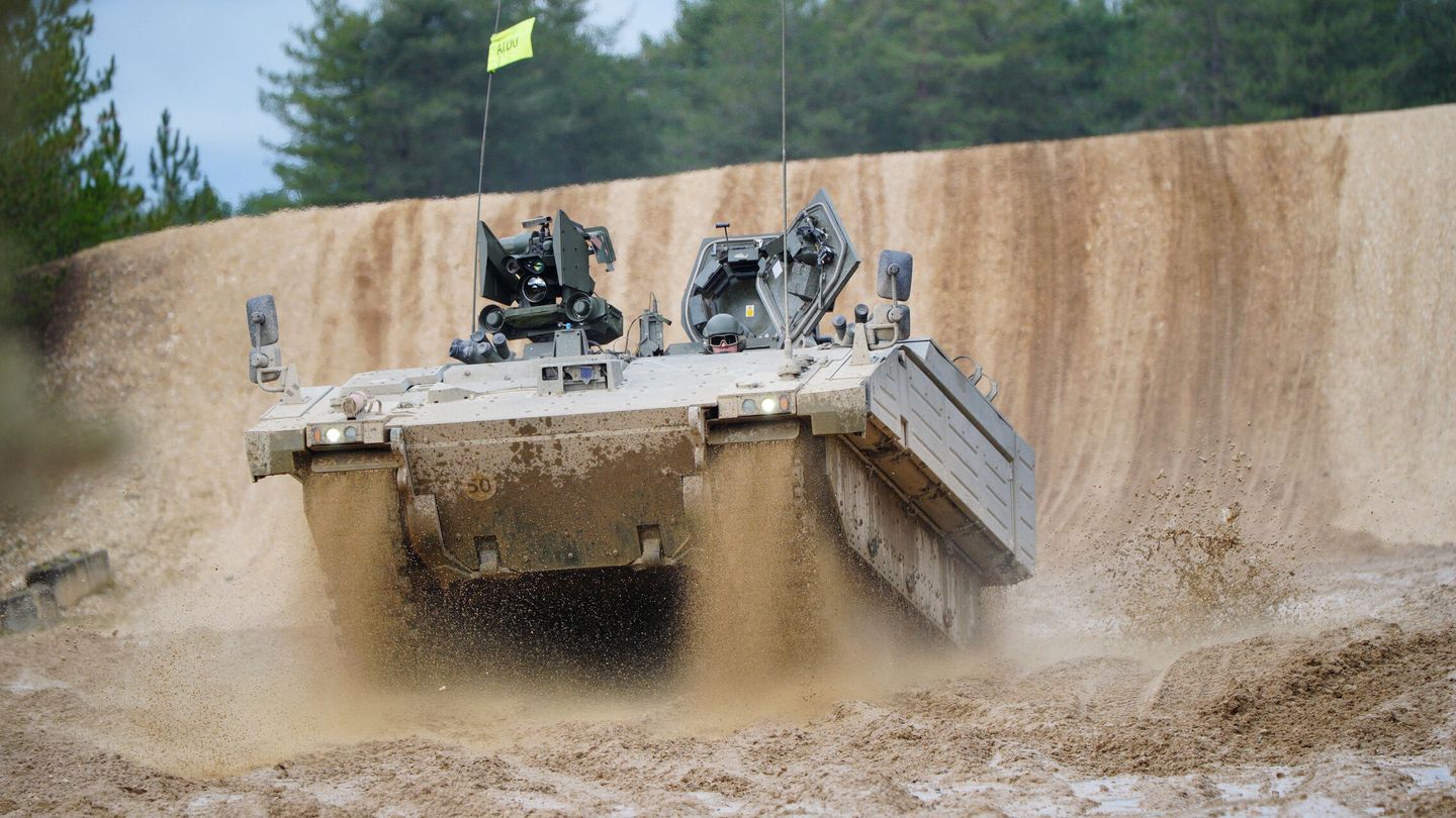 An Ajax Ares tank, an armored personnel carrier, is driven on the training range, during a visit by Defence Secretary Ben Wallace, who is viewing Ukrainian soldiers training on Challenger 2 tanks, at Bovington Camp, a British Army military base in Dorset, Britain, February 22, 2023. Ben Birchall Pool via REUTERS