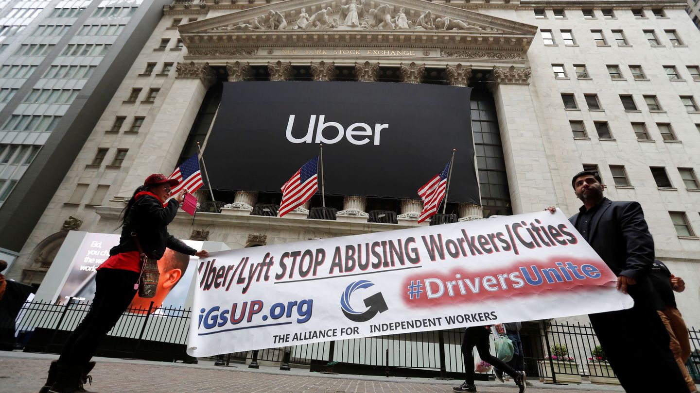 Protestors display a banner outside the New York Stock Exchange (NYSE) as Uber Technologies Inc. holds it's IPO in New York, U.S., May 10, 2019. REUTERS Andrew Kelly
