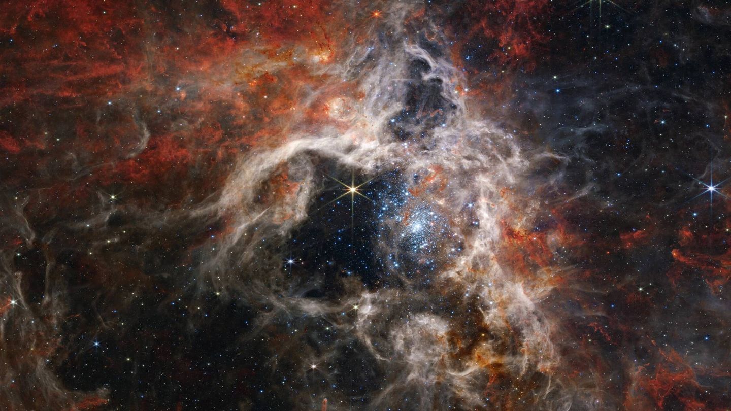 Un grupo de estrellas gigantescas protagoniza esta imagen en mosaico de la nebulosa de la Tarántula, captada por el James Webb. 