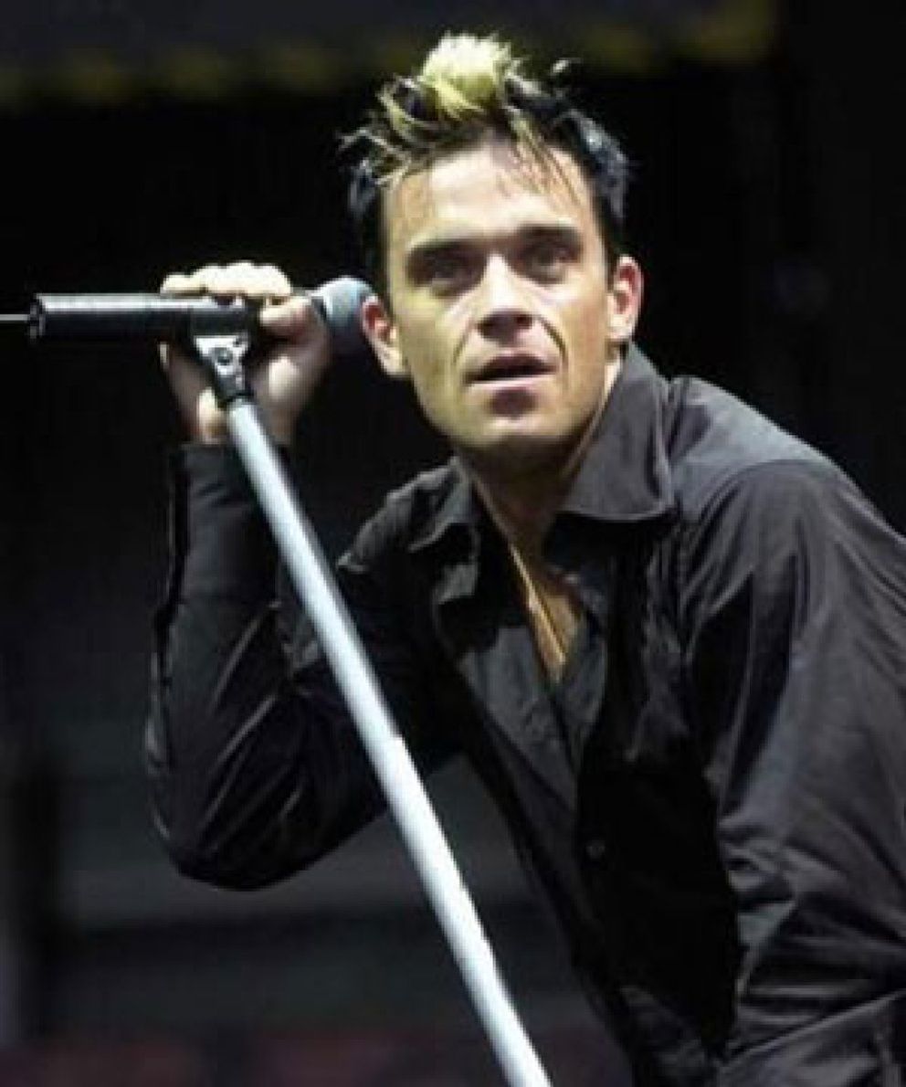 Foto: Robbie Williams volverá a Take That para escribir la biografía del grupo
