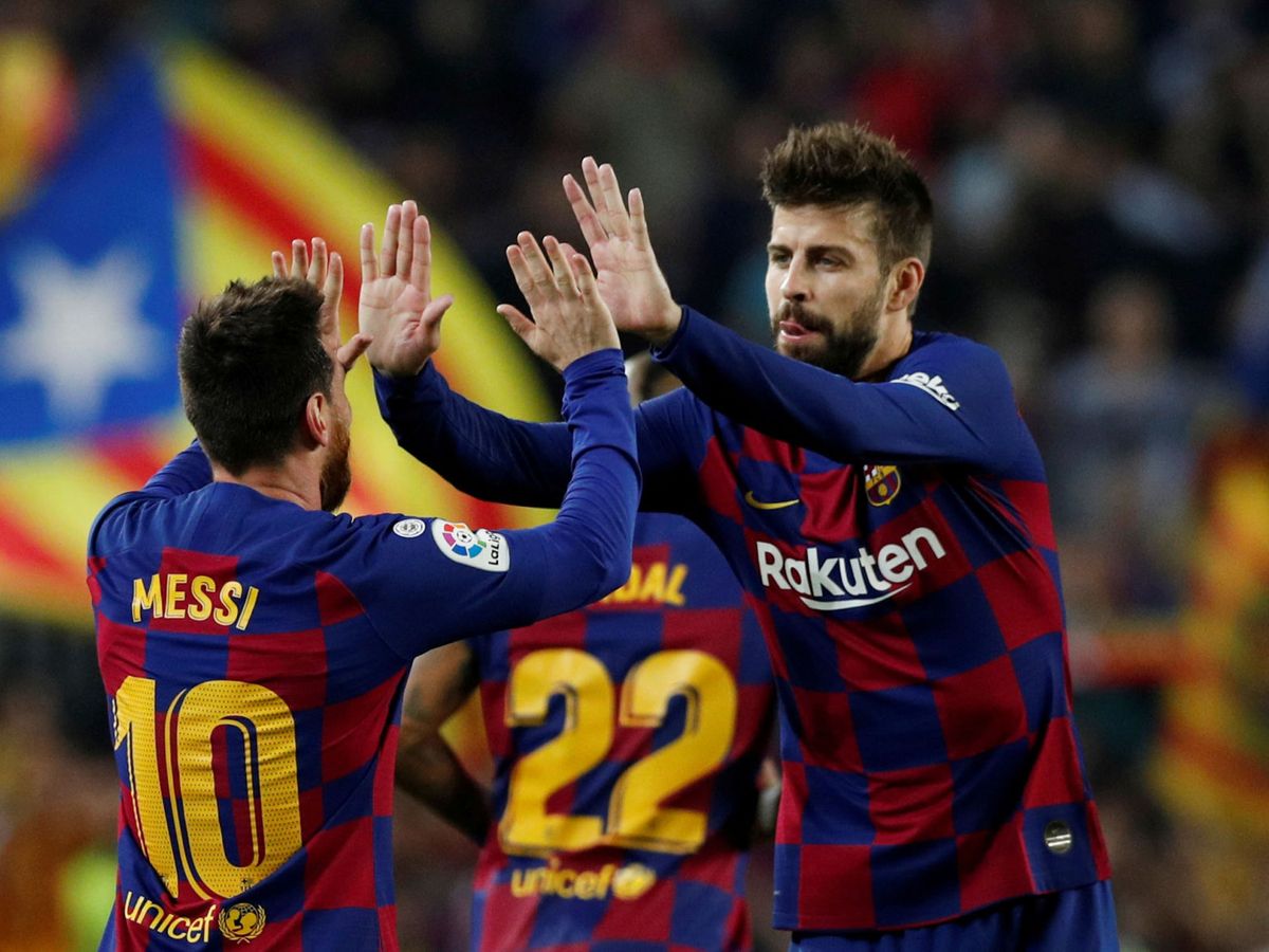 Foto: Messi con Piqué durante un partido con el FC Barcelona. (Reuters/Albert Gea)
