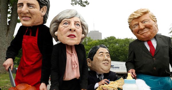 Foto: Protesta de activistas con máscaras de los líderes del G7. (Reuters)